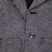 A wool overcoat in a houndstooth pattern.
