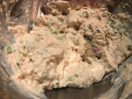 mixing tuna and cream cheese in bowl