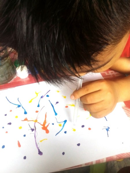 Blow Painting - child blowing paint