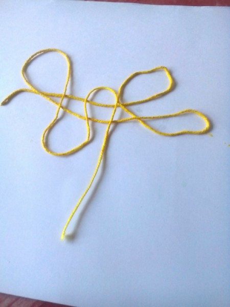 String Art Paintings - string arranged on plain paper