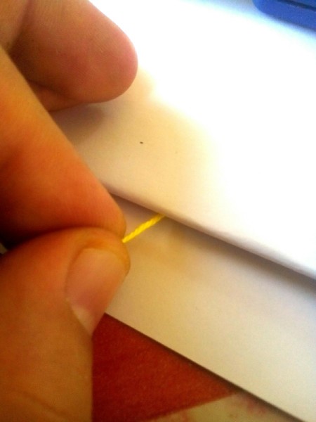 String Art Paintings - slowly pull the unpainted end of the string