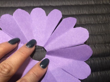 Paper Daisies - unfold and trim around the edges of the heart; make tiny notches in the hole