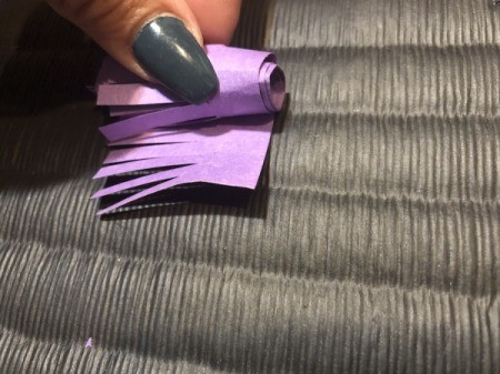 Paper Daisies - roll the fringed paper up tightly to make the flower's pistil