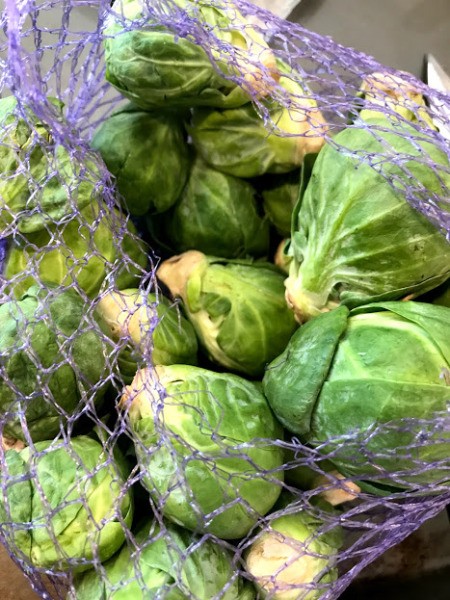 Brussels sprouts in a mesh bag.