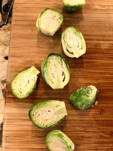 Brussels sprouts cut in half for roasting.