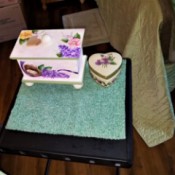 Making a Custom Table Scarf from a Placemat - new mat on table with decorative box and heart shaped box on it