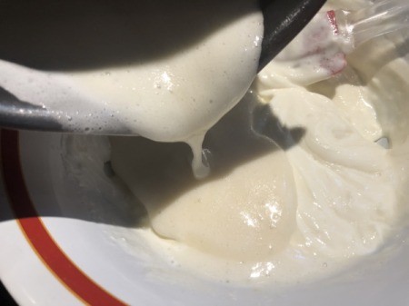 pouring marshmallow cream into cream cheese