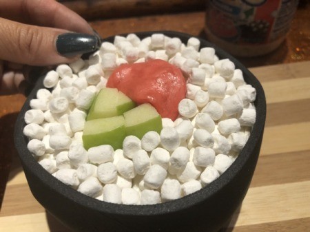 How to Make Sushi Cakes - place bits on the other cakes around the molded candies