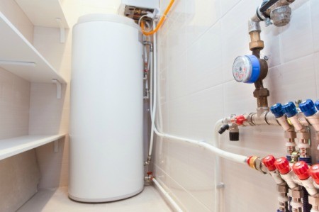 Water heater tank in a closet.