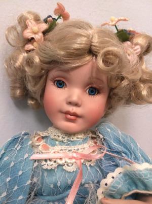 Identifying a Porcelain Doll -  blond doll with a blue dress