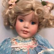 Identifying a Porcelain Doll -  blond doll with a blue dress