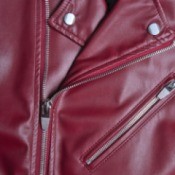 Close up of a maroon red leather jacket.