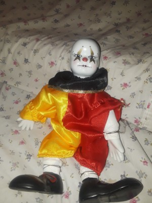 Identifying Porcelain Dolls - clown doll with yellow and red outfit