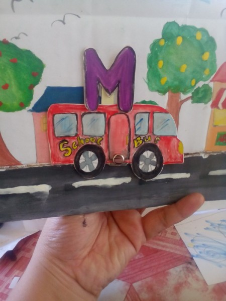 Movable Reading Card  - holding the fastener move the car and have child sound out the consonant and the vowel