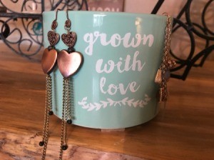 Handmade Jewelry Business Name Ideas - heart motif dangle earrings on cup