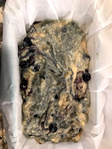 batter in lined bread pan ready to bake