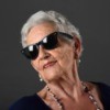 Woman with grey hair wearing sunglasses