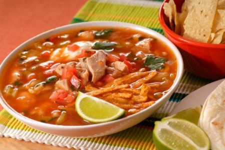 Chicken Tortilla Soup in a bowl with a lime wedge