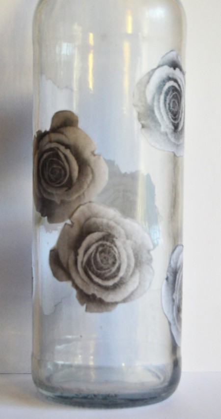 Antique Rose Upcycled Bottle Vase - apply Modge Podge to back of each rose in turn, stick to bottle apply more Mod Podge over rose and use finger to press out bubbles