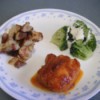 Barbecued Chicken on plate with potatoes and broccoli