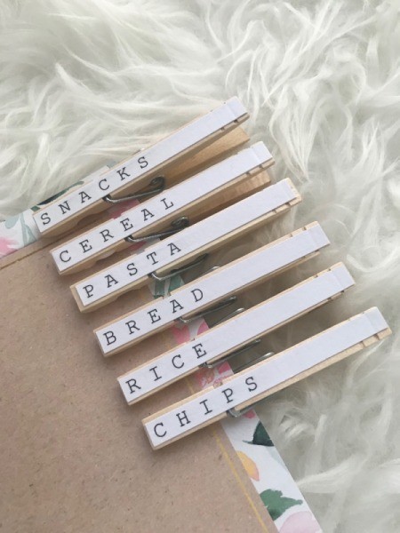 Mod Podge Clothespins - pins clipped to a piece of cardboard waiting to be used