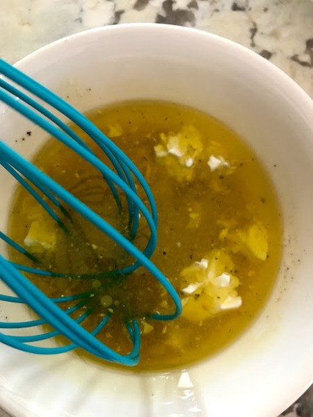 mixing dressing in bowl