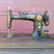Identifying an Old Treadle Sewing  Machine - old black with gold designs sewing machine