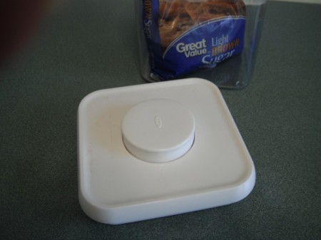 The lid to an airtight container storing brown sugar.