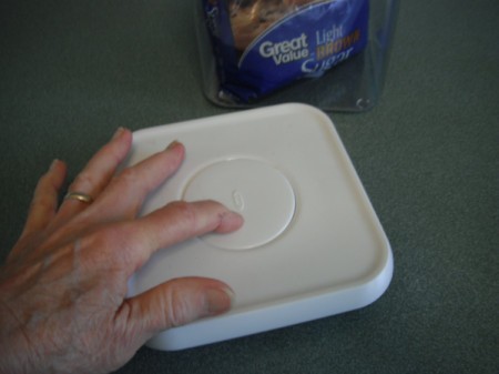 The lid to an airtight container storing brown sugar.