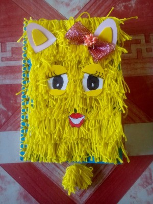 DIY Fur Covered Notebook - fuzzy yellow yarn character notebook