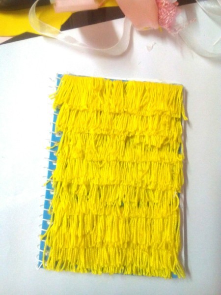 DIY Fur Covered Notebook - continue making yarn layers to the top of the notebook