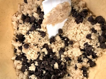 mixing chocolate chips into dough