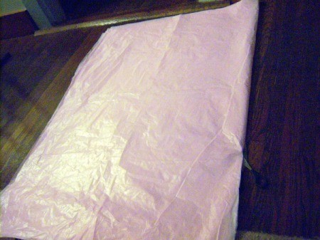 Make Big Showy Flowers from Plastic Tablecloths - continue folding in half