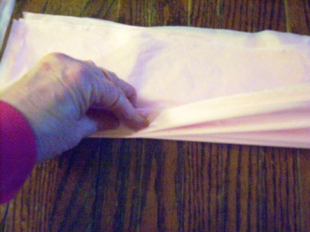 Make Big Showy Flowers from Plastic Tablecloths - keep folding