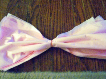 Make Big Showy Flowers from Plastic Tablecloths - add a rubber band to the center, or a string for hanging