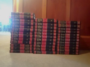 Value of Collier's Encyclopedias - stack of red and black bound volumes