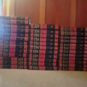 Value of Collier's Encyclopedias - stack of red and black bound volumes