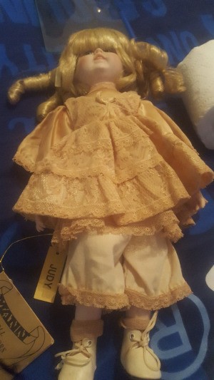 Value of a Seymour Mann Doll - blond haired doll wearing an apricot dress