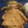 Value of a Seymour Mann Doll - blond haired doll wearing an apricot dress
