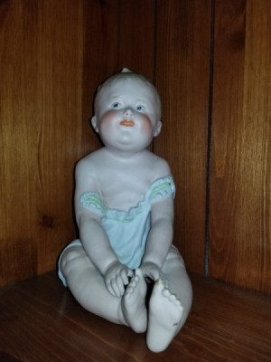 Identifying an Antique Porcelain Doll -  sitting baby doll