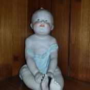 Identifying an Antique Porcelain Doll -  sitting baby doll
