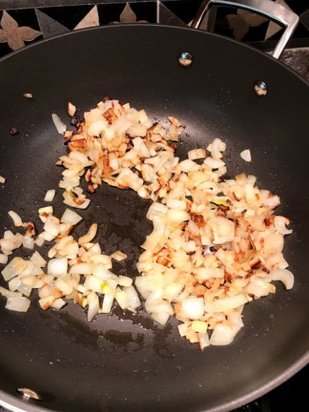 browned chopped onions in pan