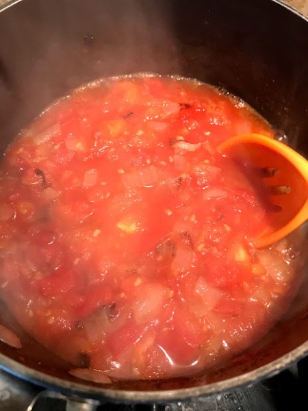 tomatoes in pan witgh onion