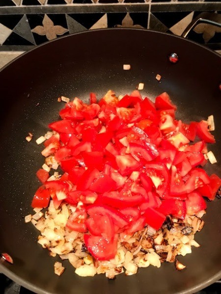 tomatoes added to onions