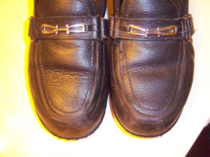 Leather shoes newly polished with candle wax.