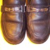 Leather shoes newly polished with candle wax.