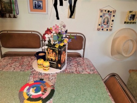 A decorative vase made from recycled VHS tapes.