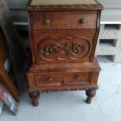 Value of an Ornately Carved End or Bedside Table