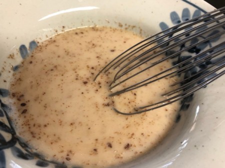 mixing almond milk and ground flax seed