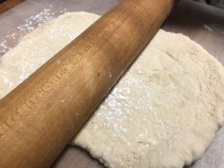 rolling pizza dough